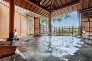 an indoor pool with water in a house at Toba Ocean Resort All-Inclusive Hotel in Toba +40 photos