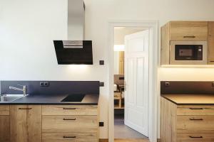 a kitchen with a sink and a microwave at Freienfeldhof Pink Lady in Lagundo