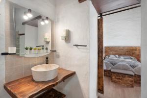 a bathroom with a sink and a bed at El Rincón de Yeico in Isora +15 photos