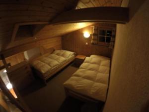 an overhead view of a room with two beds at Apartment Chalet Steinbock by Interhome in Lenk