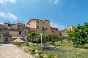 a playground in a yard in front of a building at Dimora Storica Lucia in Ascea