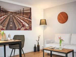 a living room with a couch and a table at Apartment Hirschen Erlinsbach by Interhome in Erlinsbach