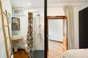 a bathroom with a shower and a sink at Carmelo y Carmela 2 in Teror +21 photos
