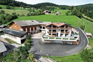 an aerial view of a large house in a field at Parliflhof Apt Laugenblick in Meltina