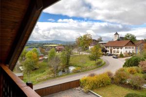 a view from a balcony of a house with a road at Ferienhaus Brigitte - Breitnau in Breitnau