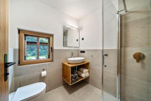 a bathroom with a sink and a shower at Chalet Lanthalerhof in San Martino +30 photos