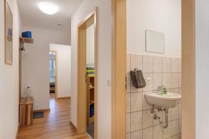 a bathroom with a sink and a mirror at Gantershof in Titisee-Neustadt +109 photos