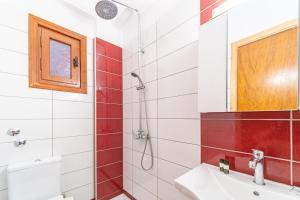 a bathroom with a shower and a sink at Arianna Studio Ground Floor 6 in Paleokastritsa +15 photos