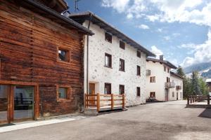 an exterior view of a building with wood at Appartamenti Elisabetta n2 in Livigno