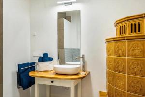a bathroom with a sink and a mirror at Suiten im Alten Berghotel Franziska in Eslohe +24 photos