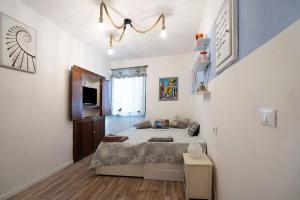 a small bedroom with a bed in a room at Hemingway's Shelter in La Spezia