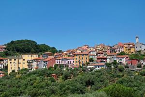 a group of houses on a hill with trees at Hemingway's Shelter in La Spezia