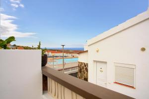 a balcony with a view of the ocean at Calida Vivienda Accesible in Caleta De Fuste