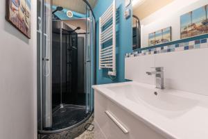a bathroom with a sink and a shower at Kervalou in Sainte Anne d'Auray