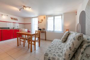 a living room with a couch and a table at Kervalou in Sainte Anne d'Auray +13 photos