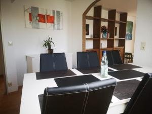 a conference room with a table with a bottle of water on it at Ferienwohnung Eckert in Wehr