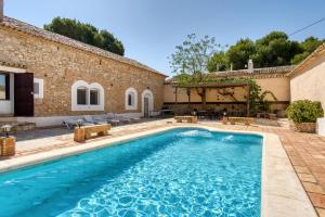 a pool in front of a house at Madara in Monóvar