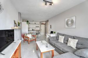 a living room with a couch and a table at Apartamento Retama in Adeje