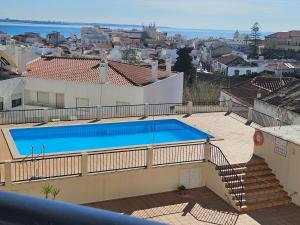 a swimming pool on the roof of a house at Your Secret in Lagos in Lagos