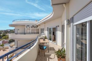 a balcony with a view of a house at Your Secret in Lagos in Lagos