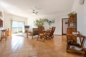 a dining room and living room with a table and chairs at Your Secret in Lagos in Lagos