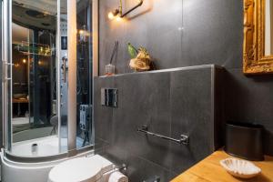 a bathroom with a shower and a toilet and a sink at A Ugghia in Fiumefreddo di Sicilia +27 photos