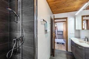 a bathroom with a shower and a sink at Am Wehrastrand App Eg in Todtmoos