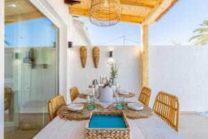 a dining room with a table and chairs at El Pinito Moraira in Moraira
