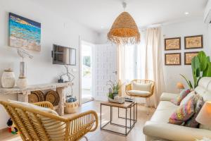 a living room with a couch and a fireplace at El Pinito Moraira in Moraira