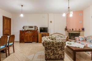 a living room with a couch and a table at Moraki Apartment 1 Andros in Korthi