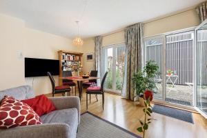 a living room with a couch and a table at Ferienwohnung Rosenrot in Überlingen