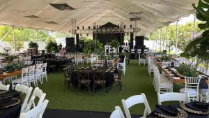 a group of tables and chairs in a tent at Hotel Royal Garden Tuxpan in Cobos