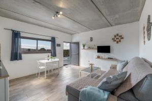 a living room with a couch and a table at Casa Jonas in Tías