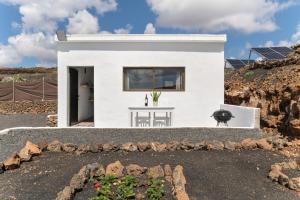 a white house on top of a mountain at Casa Jonas in Tías