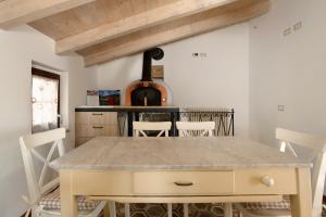 a dining room with a table and chairs at Il Giostro 1 Biassa in La Spezia +15 photos