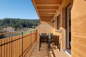 a balcony with a table and chairs on it at Gantershof in Titisee-Neustadt