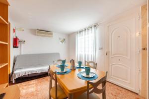 a small room with a table and a bed at La Noria 3 in El Pozo de los Frailes