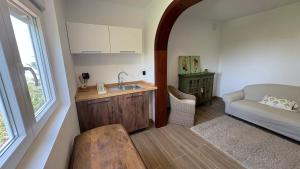 a kitchen with a sink and a couch in a room at Bastion del Drago in Arucas +125 photos