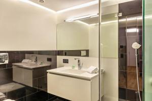 a bathroom with a sink and a shower at Haus Excelsior Top 30 in Seefeld in Tirol +13 photos