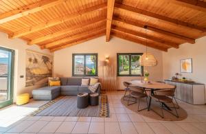 a living room with a couch and a table at Central Penthouse Luino in Luino