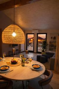 a dining room with a table with wine glasses at Central Penthouse Luino in Luino +36 photos
