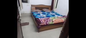a small room with a small bed in it at Hotel prayag with ev car station 7,4kw in Nāthdwāra