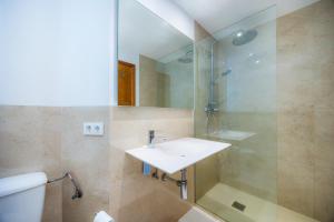 a bathroom with a sink and a shower at Catalina 3b in Port de Pollensa +27 photos