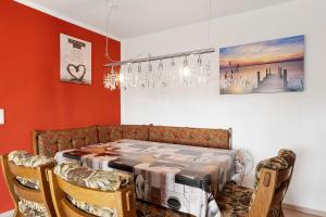 a dining room with a table and two chairs at Lebensblume in Ilshofen