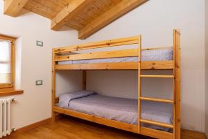 a bunk bed room with two bunk beds in a house at Maso Gigi in Castel Ivano