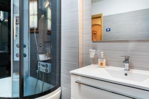 a bathroom with a shower and a sink and a mirror at Maso Gigi in Castel Ivano +32 photos