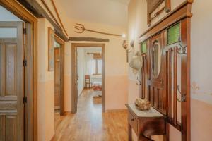 a hallway of a home with a wooden door at La Cardeñuela in Burgos