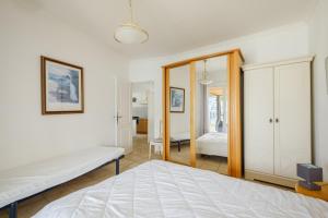 a bedroom with a bed and a mirror at Maison avec Piscine in Tourrettes +17 photos