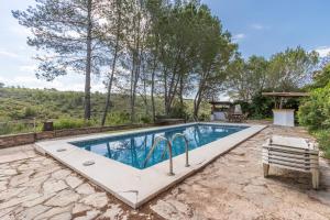 an image of a swimming pool in a yard at Can Favo in Copóns