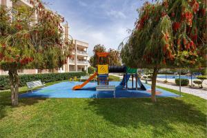 a playground in a park with a slide at Sol do Atlântico in Portimão